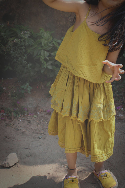 Side view showcasing twirl-friendly layers and raw edge details