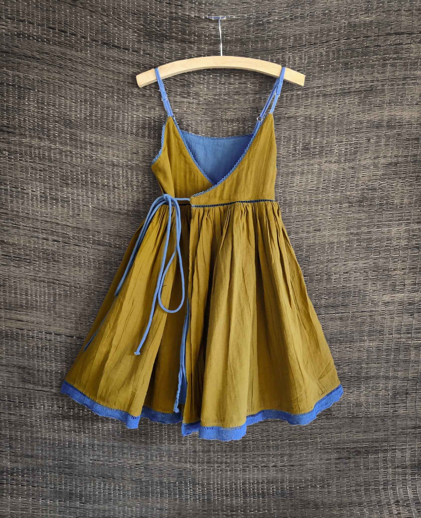 Back view showing olive side of the reversible dress with delicate lace details