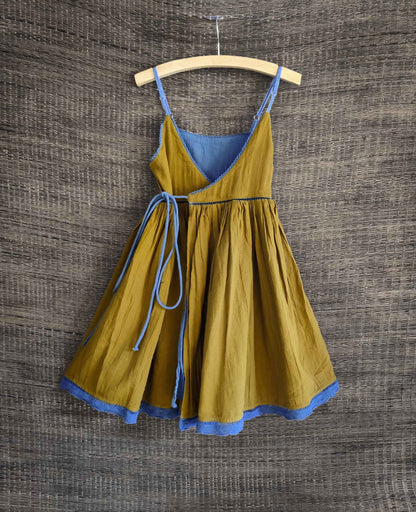 Back view showing olive side of the reversible dress with delicate lace details