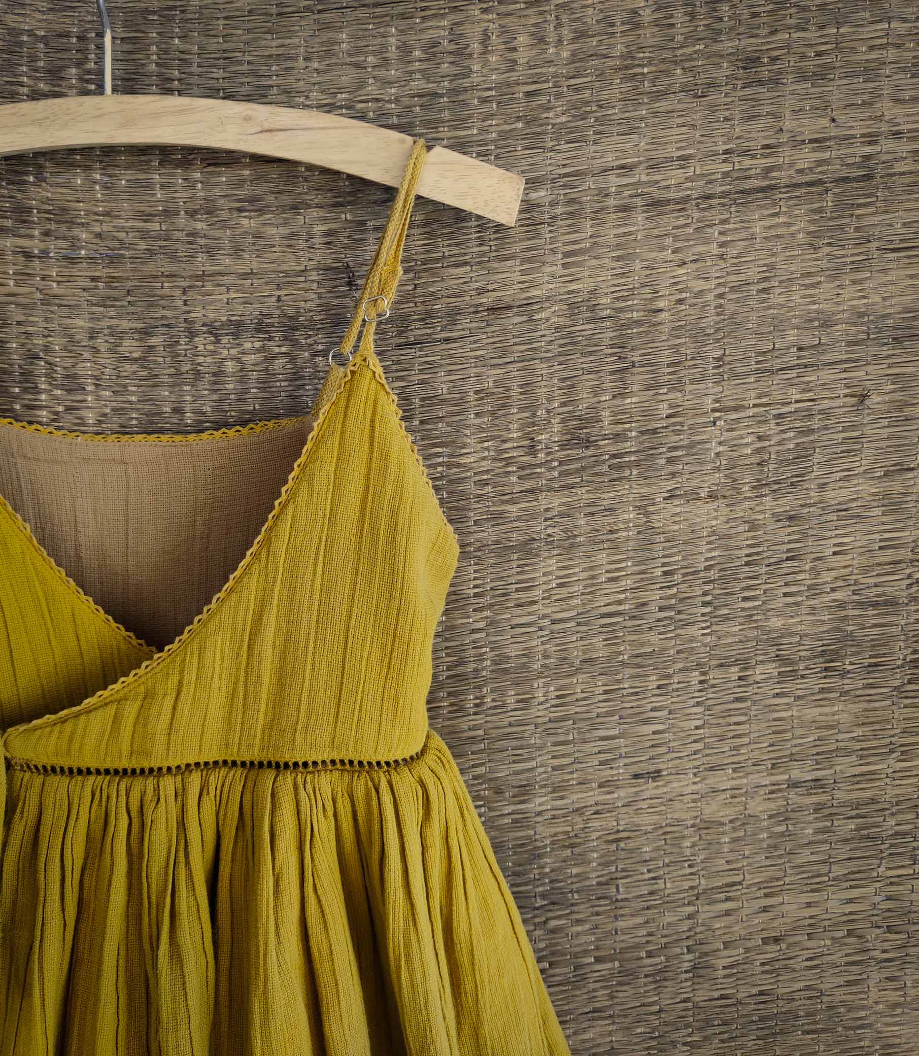 Close-up of lace detailing on Yellow side of dress